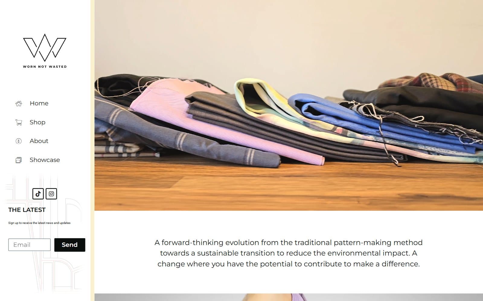 The Worn Not Wasted homepage with its side navigation and a photo of folded fabric