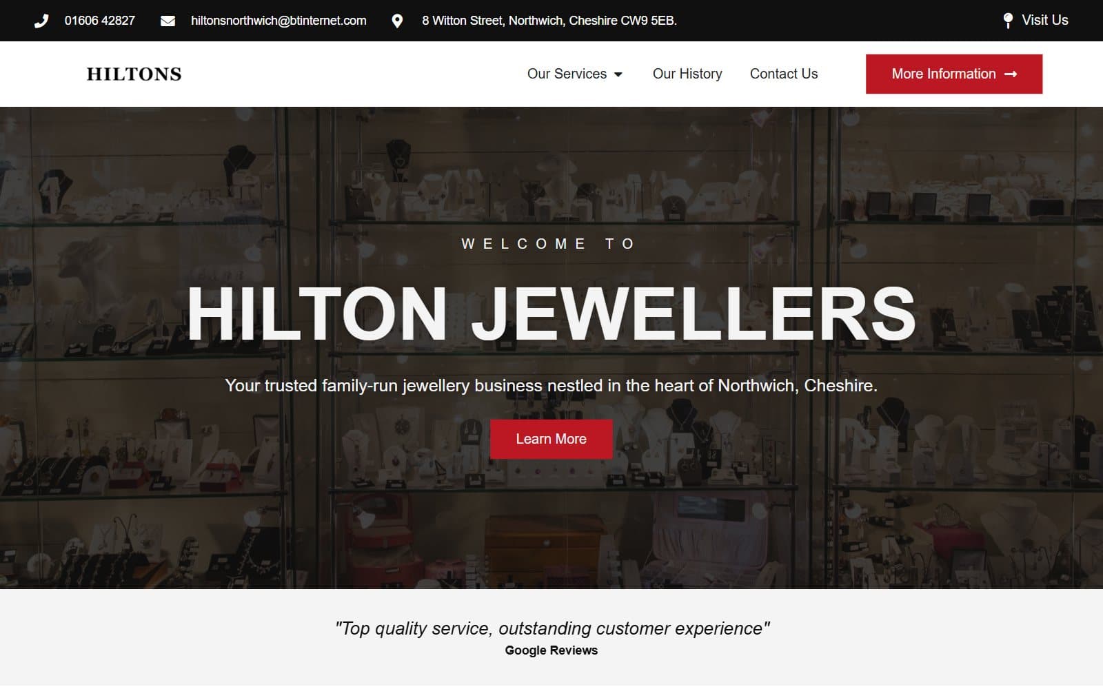 The Hilton Jewellers homepage over a photo of the shop's jewellery display cabinets
